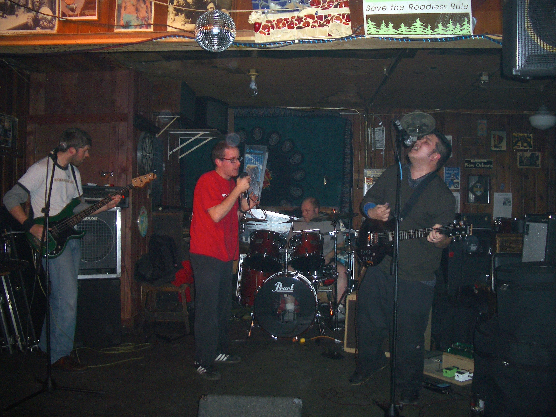 the band playing a show at a bar