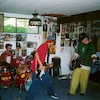 an icon of a band practicing in a basement