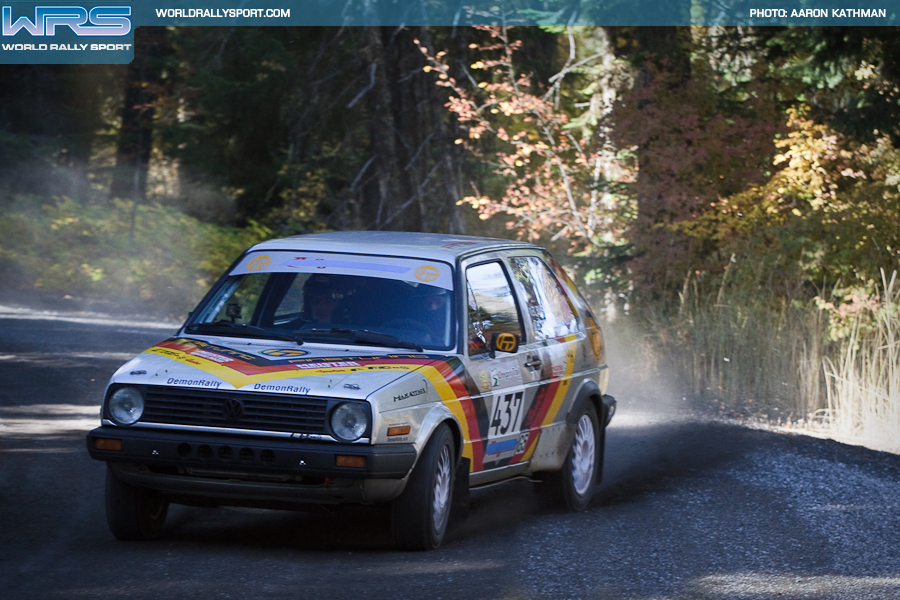 a volkswagen gti goes maximum attack out of a rally corner