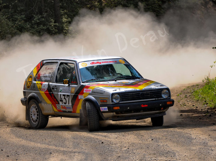 a volkswagen gti gets very sideways on a gravel road