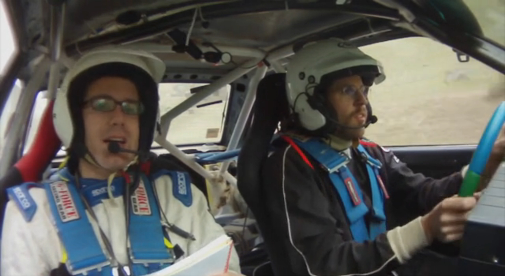 a rally driver and co-driver from the inside of the car