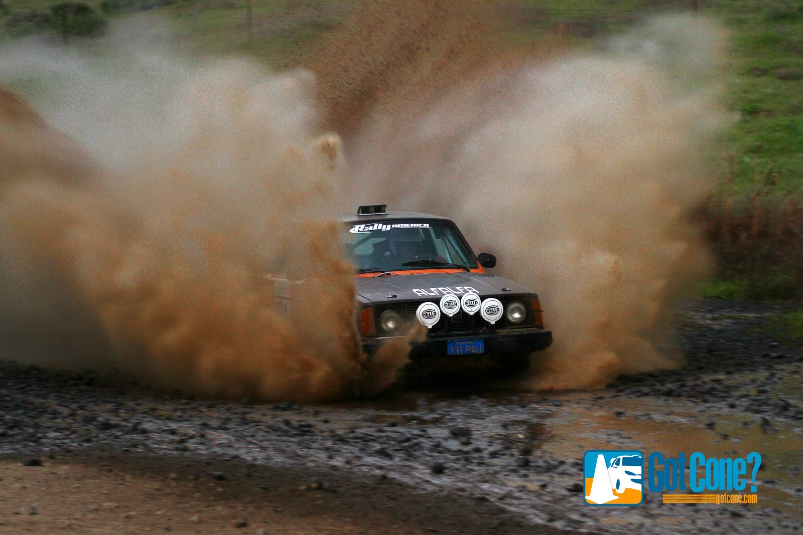 a volvo splashing through a puddle