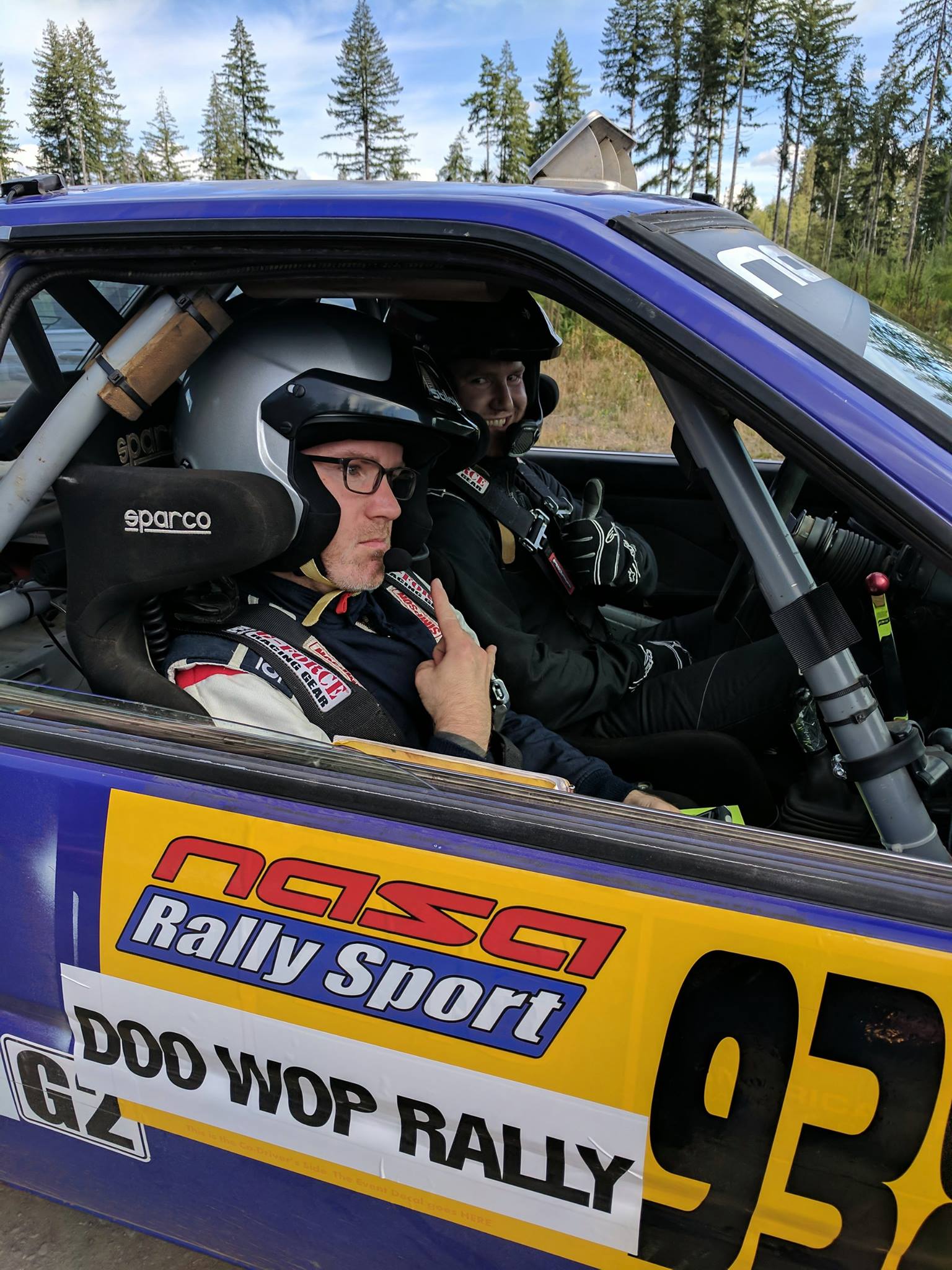 a rally team sitting in the car at the start of a stage