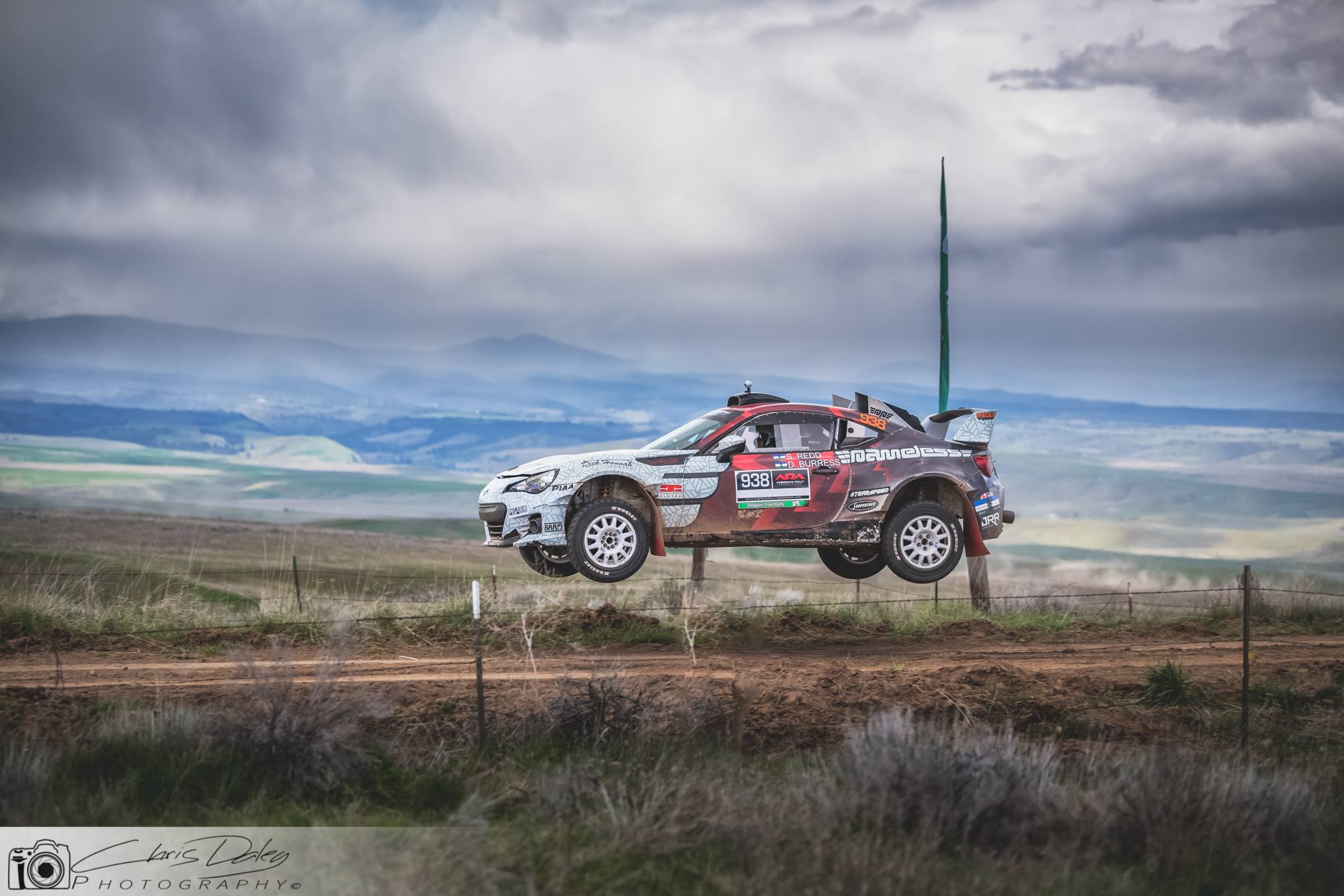 a subaru brz rally car jumping very high